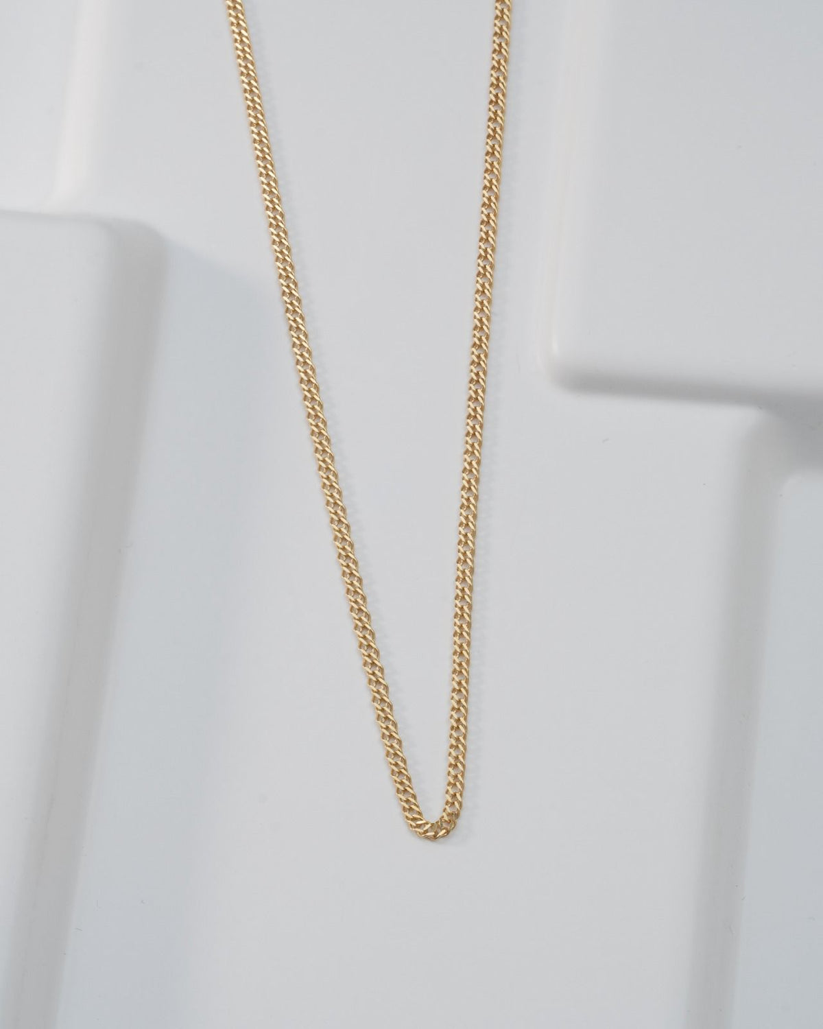 Chain cuban cruzada 2,4 mm 65 Cms oro laminado